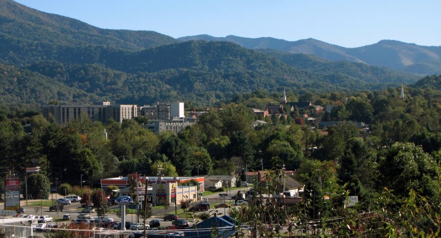 Vibrant blue sky above Downtown Waynesville, indicating clear weather and sunshine.
