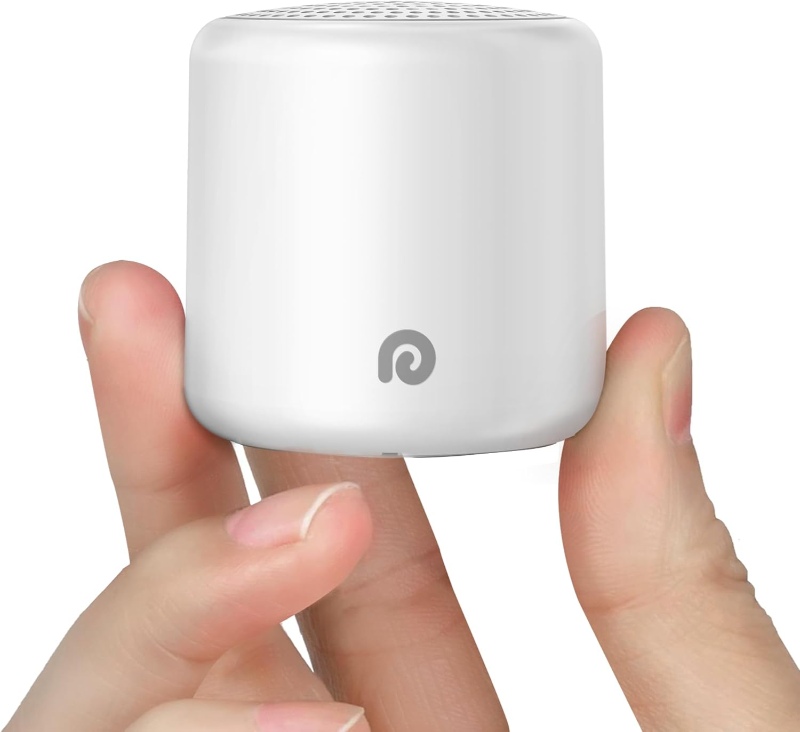 Hand grasping a compact white speaker, the Dreamegg Pocket Travel Sound Machine, ideal for travel and relaxation.