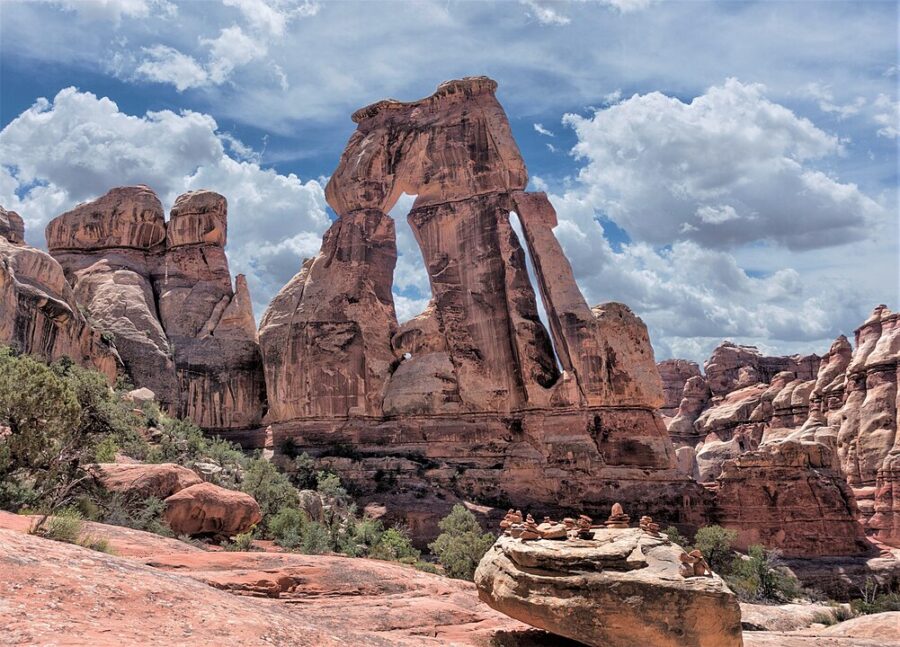Druid Arch stands majestically in Canyonlands National Park, surrounded by vibrant red rock formations and vast canyon views.