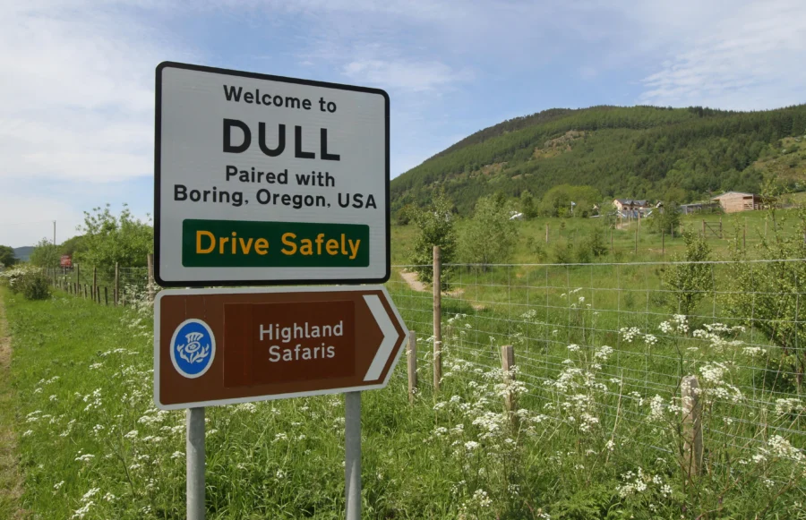Welcome to Dull, Scotland: Paired with Boring, Oregon, amidst lush green hills.