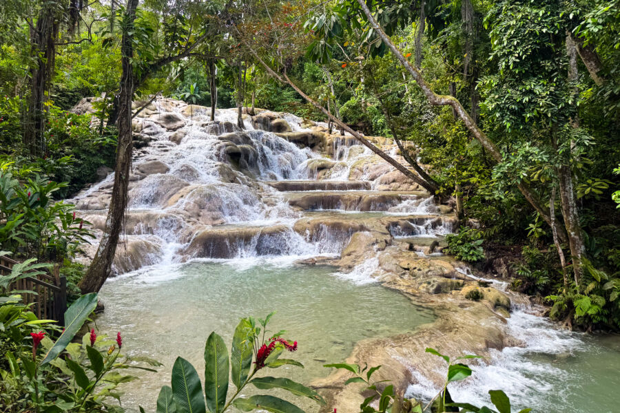 Scenic view of Dunn's River Falls in Ocho Rios, Jamaica, showcasing cascading water and lush tropical surroundings