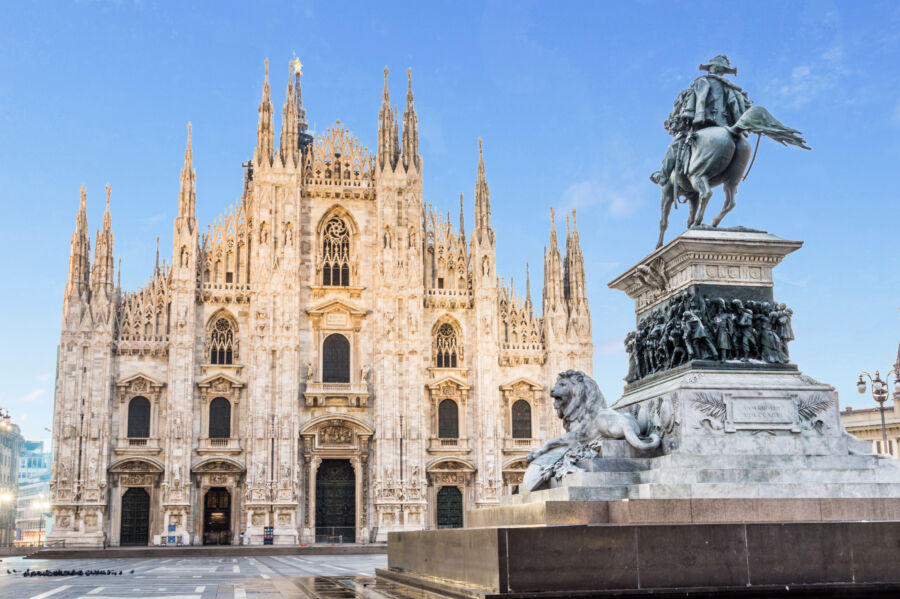 Exterior view of Duomo di Milano, showcasing its stunning architecture and the statue of Vittorio Emanuele II in Milan, Italy