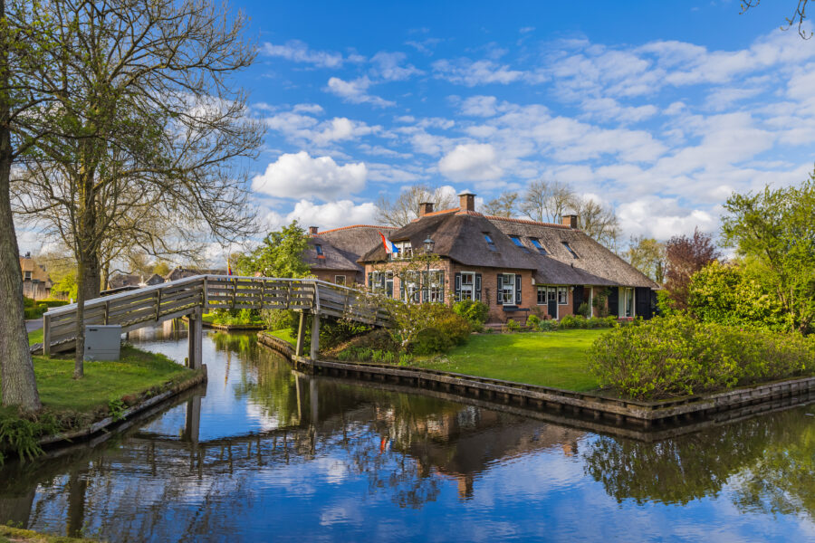 Giethoorn, a picturesque Dutch village, features charming canals, traditional houses, and lush greenery.
