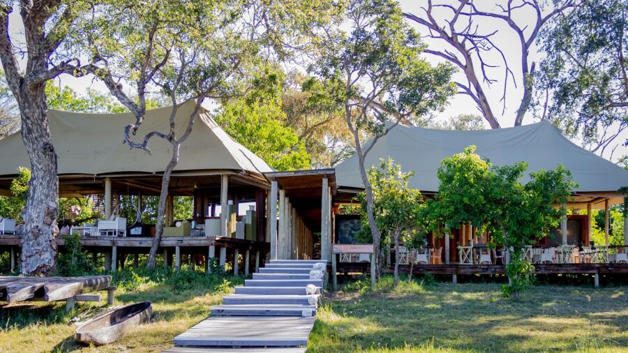 Eco-friendly retreat with rustic architecture, natural materials, and lush greenery.