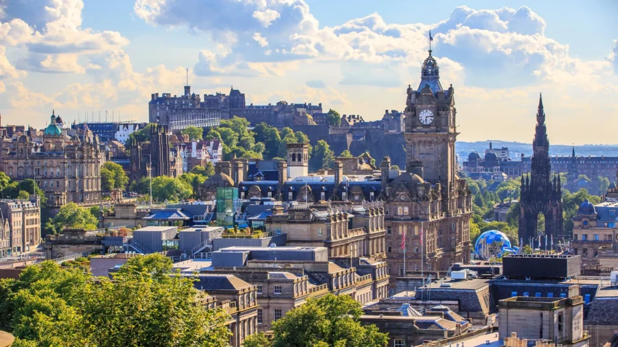 Edinburgh skyline with historic landmarks, clock tower, Scott Monument, and Castle Rock.