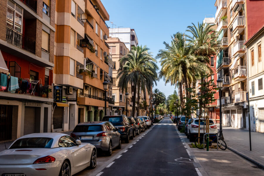 Colorful buildings line the streets of El Cabanyal, Valencia, showcasing vibrant architecture and local culture