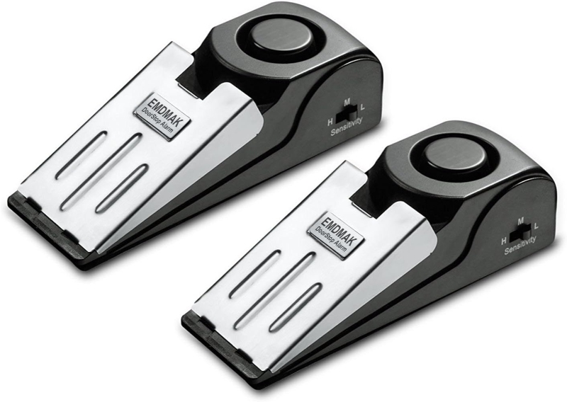 Two black and white electronic foot pedals on a white background, designed for the EMDMAK Portable Door Stop Alarm.