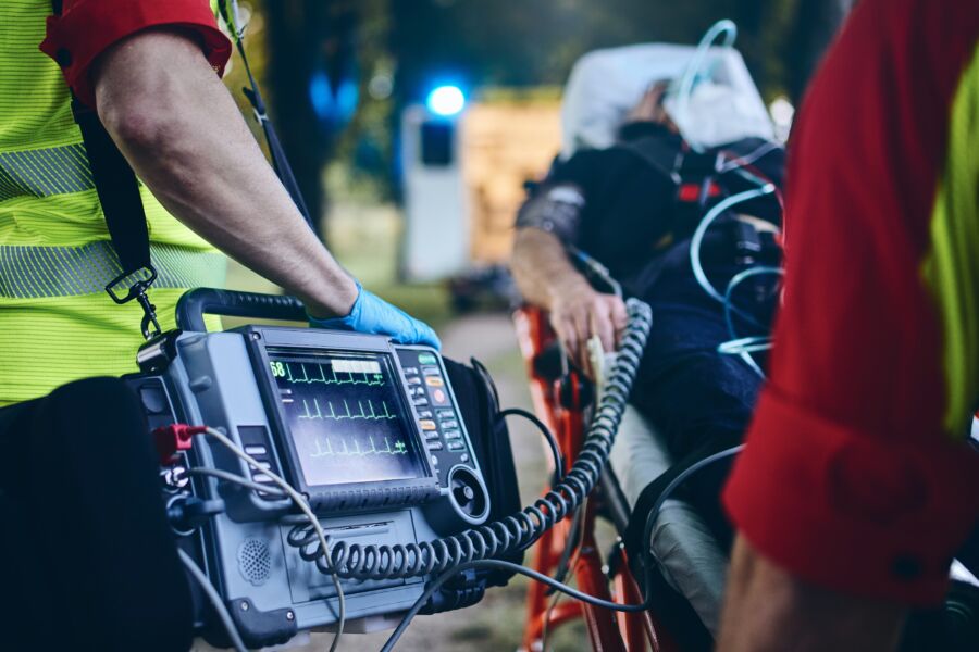 Team of emergency medical service professionals in uniforms, preparing to assist patients at an emergency scene