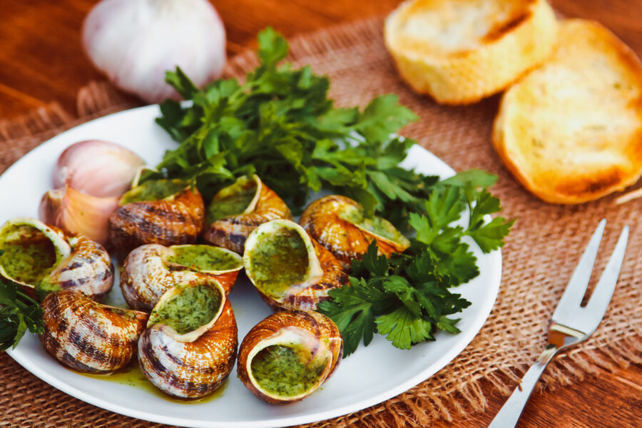 Escargots de Bourgogne snails with garlic herb butter, parsley, and toasted crostini.