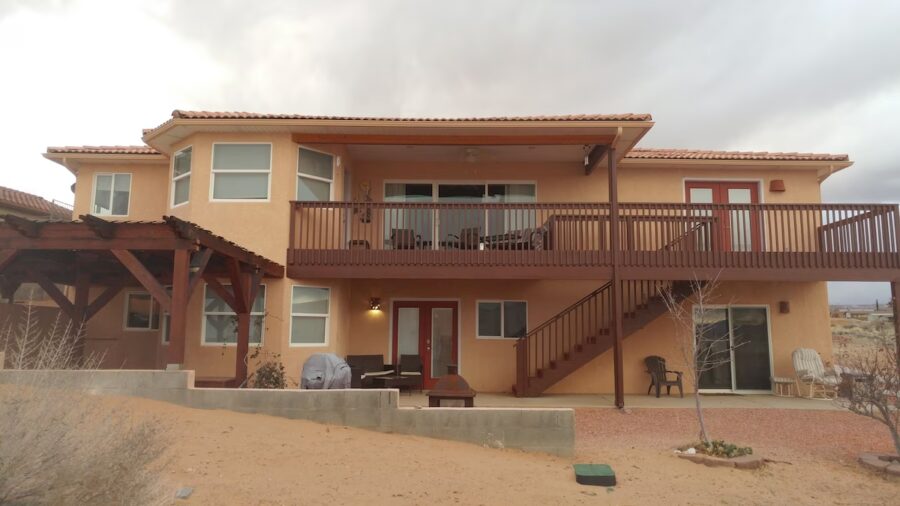 Spacious home featuring a balcony and deck, offering exceptional views of Lake Powell.