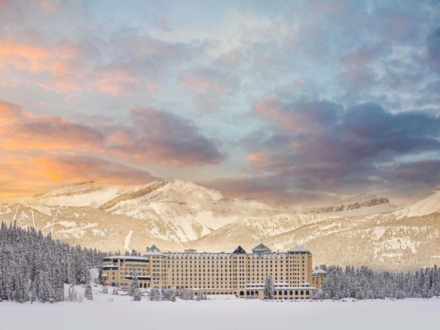 The iconic Fairmont Banff Springs Hotel nestled in the scenic landscape of Banff, Alberta, showcasing its grand architecture.