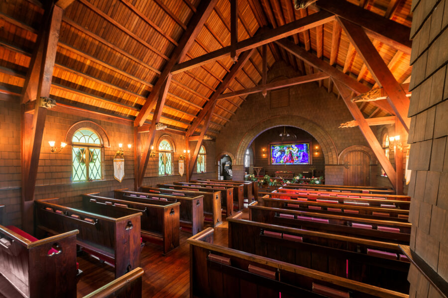 Interior view of the historic Faith Chapel on Jekyll Island, showcasing its beautiful architecture and stained glass windows.
