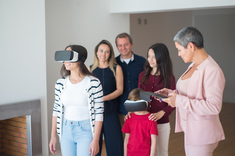 Family exploring virtual reality technology together in a bright, modern room.