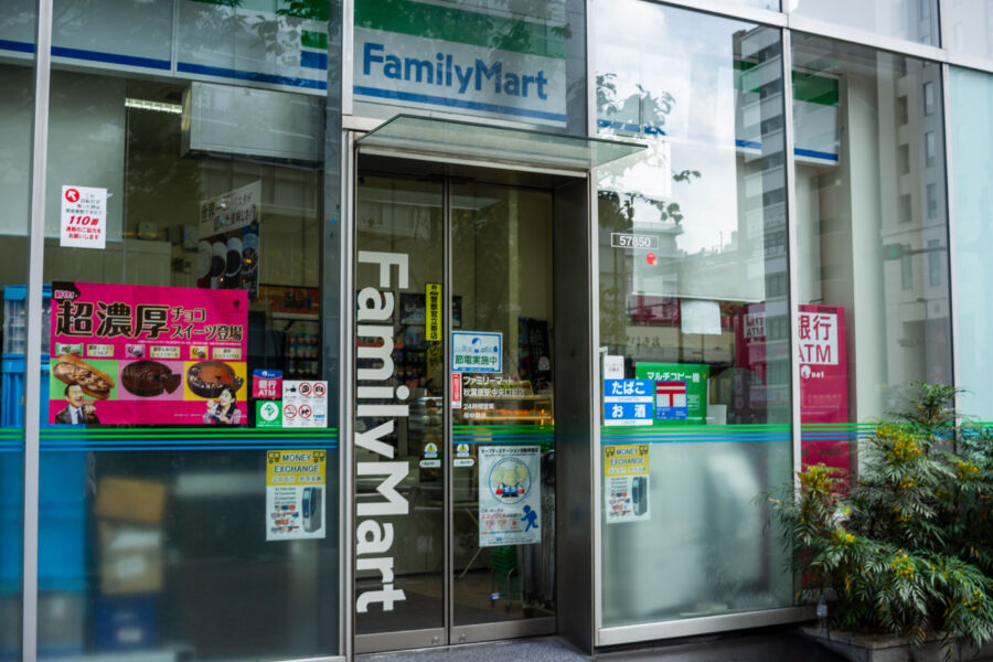 FamilyMart convenience store exterior in Tokyo, Japan, showcasing colorful signage and a clean, inviting storefront.
