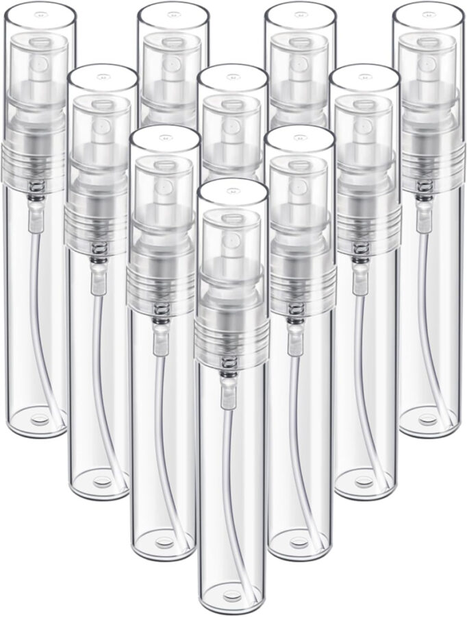 Set of six clear plastic spray bottles, labeled Fandamei Mini Travel Spray Bottles, ideal for travel and personal use.