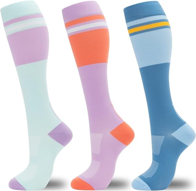 Three pairs of fenglaoda colorful compression socks in vibrant hues displayed together on a neutral background.