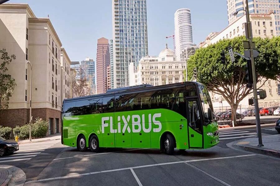 FlixBus in vibrant cityscape, highlighting urban travel, sustainability, and modern transportation solutions.