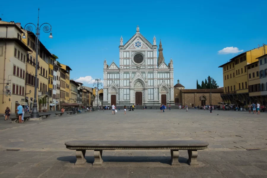 Basilica of Santa Croce and lively square in Florence, a hub of history and architecture.