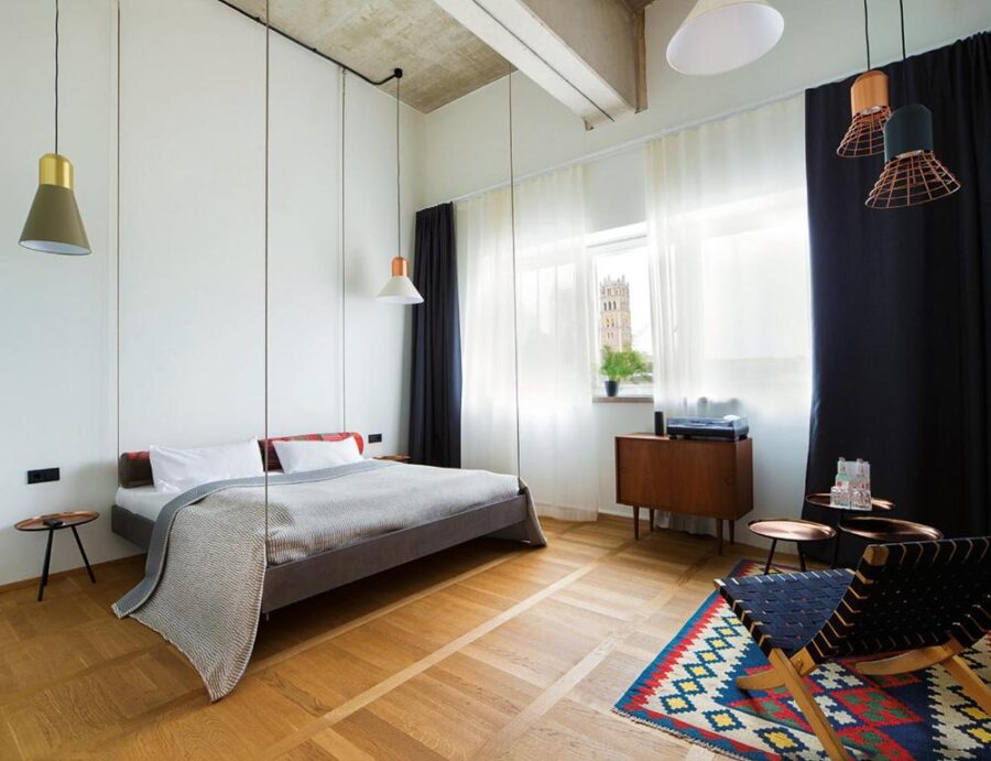 Interior view of a Flushing Meadows Hotel bed in Munich, showcasing modern design and cozy bedding.