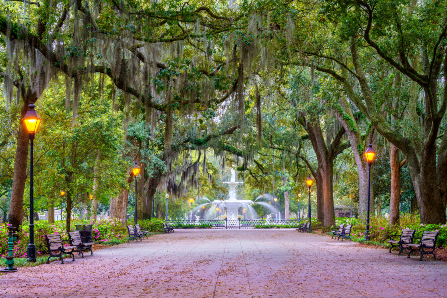 The iconic Forsyth Fountain in Forsyth Park, Savannah, Georgia, featuring intricate sculptures and vibrant landscaping.
