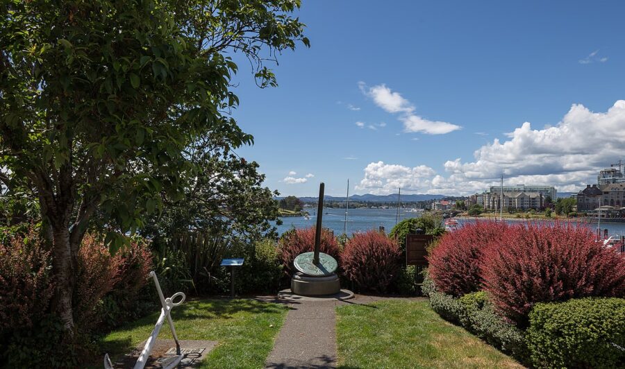 Fort Victoria National Historic Site park, highlighting a boat on the water and a tree nearby in Victoria, Canada.