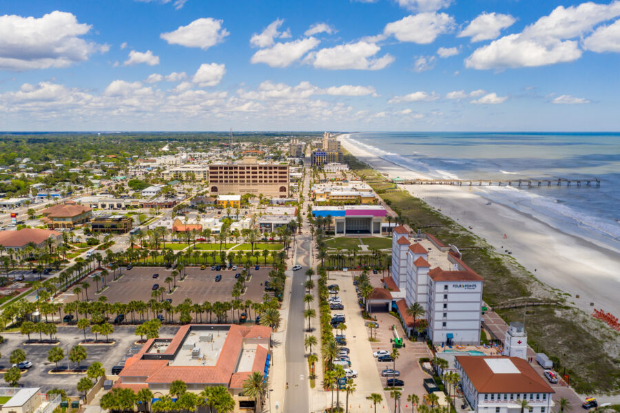 Exterior view of Four Pointe Hotel in Jacksonville Beach, showcasing its contemporary design and proximity to the ocean.