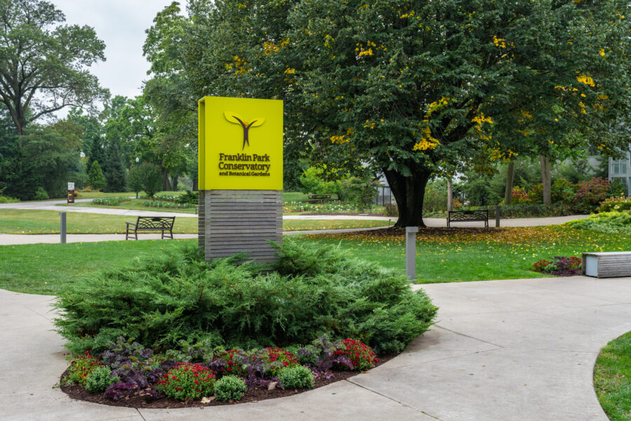 Entrance sign for Franklin Park Conservatory and Botanical Gardens, inviting guests to explore the vibrant plant collections