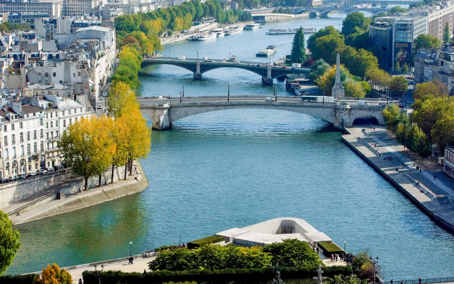 Freshly baked bread by the Seine River in Paris, offering scenic views.