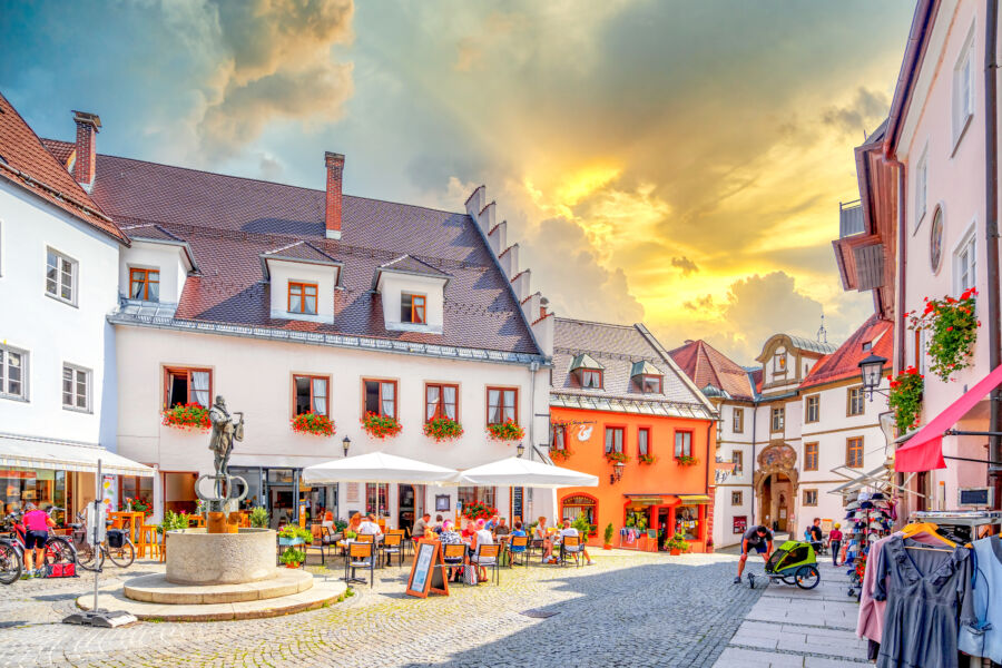Scenic view of Füssen's Old Town in Germany, showcasing historic buildings and charming streets under a clear blue sky