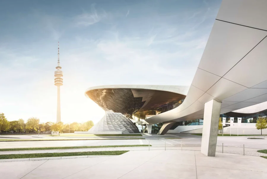 BMW World futuristic pavilion plaza with saucer canopy, glass prism, and observation tower.