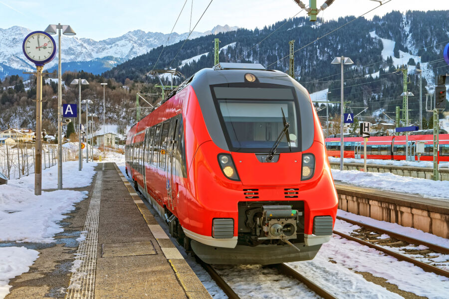 Bright red train awaits passengers at the Garmisch-Partenkirchen station in Germany