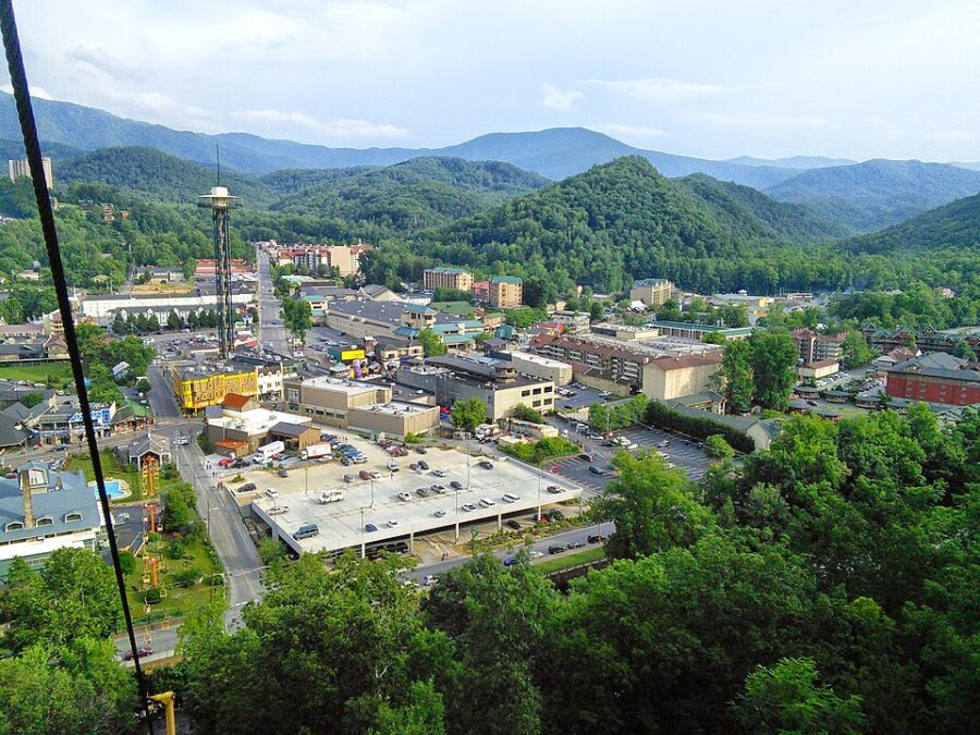 Scenic view of Gatlinburg from a cable car, highlighting the city’s skyline and surrounding mountains.