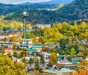 Scenic view of Gatlinburg, Tennessee, showcasing the town's charming buildings and surrounding mountains.
