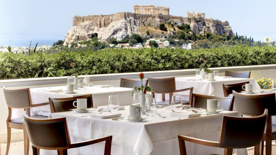 GB Roof Garden Restaurant in Athens, featuring a stunning view of the Parthenon against a clear blue sky.
