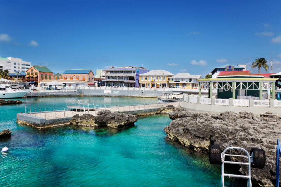 Panoramic view of the waterfront shopping center in George Town, Grand Cayman, with shops and a vibrant atmosphere
