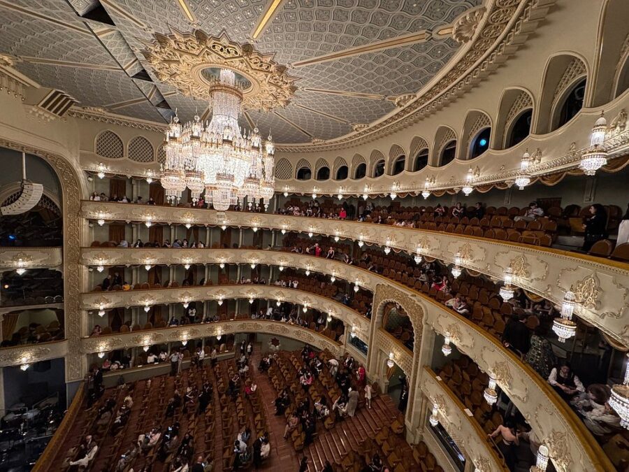 Interior view of the Tbilisi Opera and Ballet State Theatre, showcasing ornate architecture and elegant seating arrangements.
