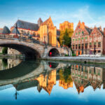 Medieval cathedral and bridge over a canal in Ghent - Gent, Belgium