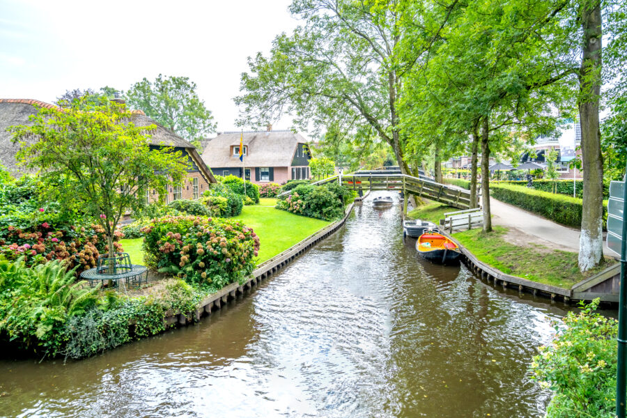 Charming old houses in the center of Giethoorn, Netherlands, beside the canals, celebrated as the Venice of the North