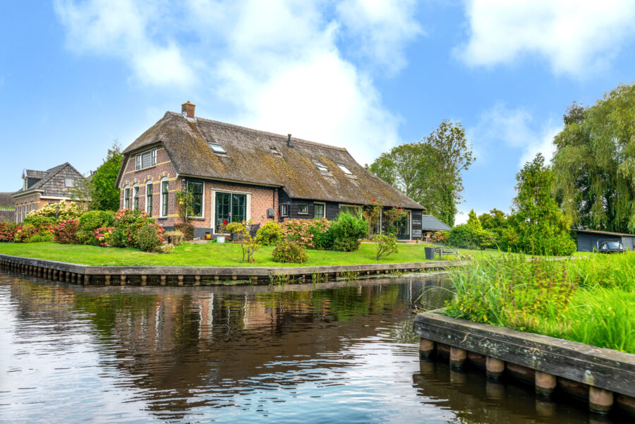 Giethoorn's old town showcases scenic canals and traditional thatched-roof houses in a picturesque setting