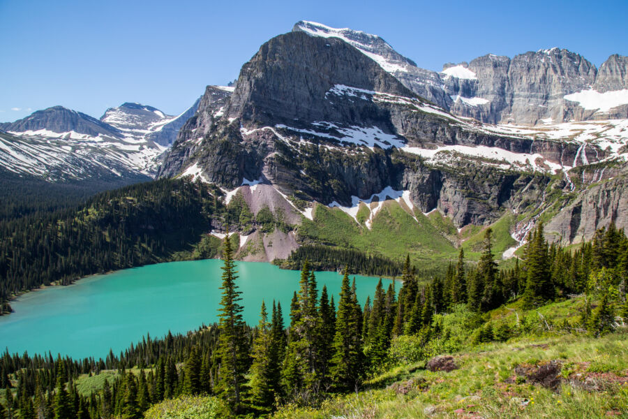 Scenic view of Glacier National Park, showcasing majestic mountains and serene lakes in Montana