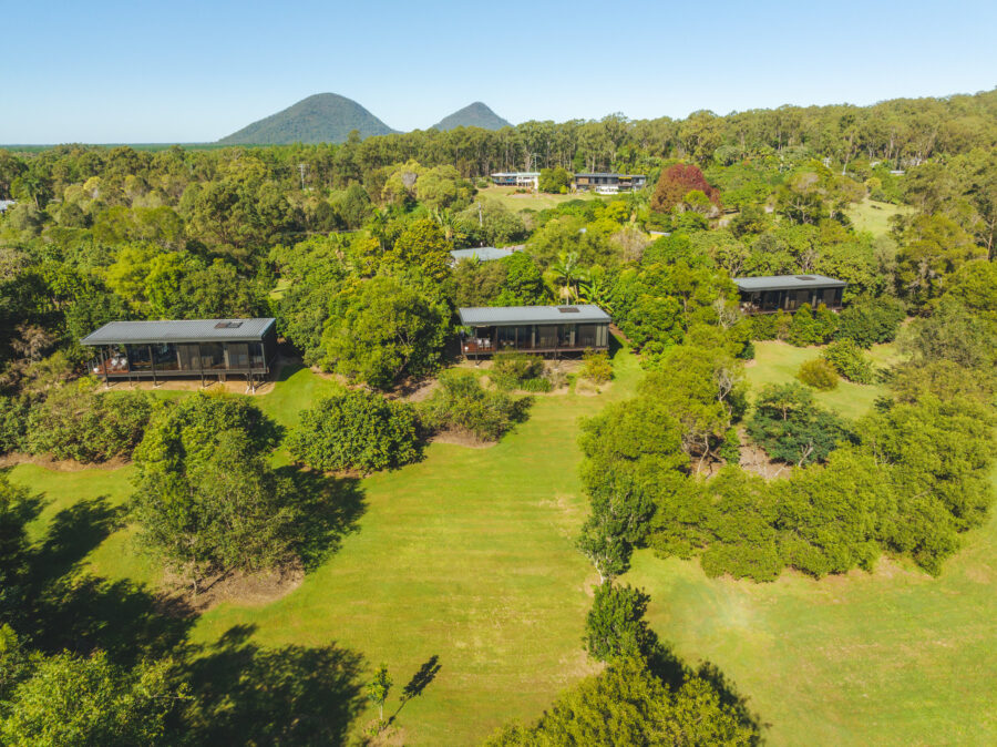Romantic Glass on Glasshouse hinterland retreat with modern cabins and Glass House Mountains views.