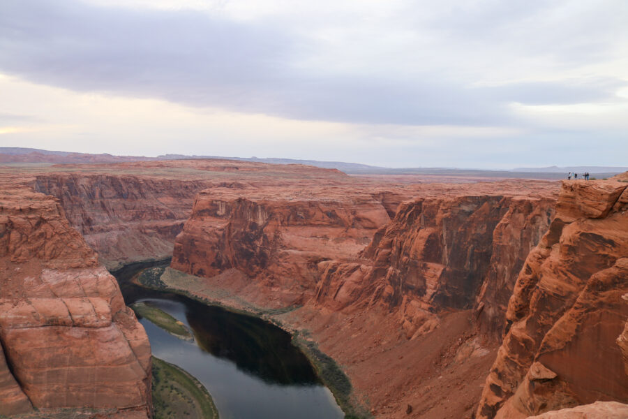 The Colorado River flows through the stunning sandstone canyon of Horseshoe Bend in Glen Canyon National Recreation Area, Arizona.

