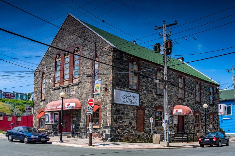Exterior view of a building featuring a red awning on George Street, St. John’s, Newfoundland, Canada.