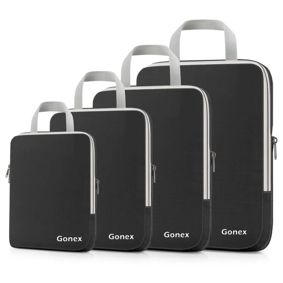 Gonex compression packing cubes set, four black travel organizer bags with zippers and handles.