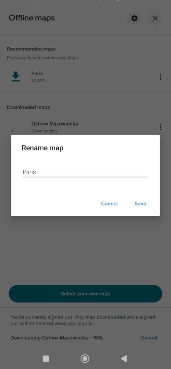Screenshot of an offline maps interface showing a recommended map of Paris being 30 MB. A renaming dialog box for 'Paris' is open with options to cancel or save. Another map, 'Ostrów Mazowiecka,' is shown downloading at 98%
