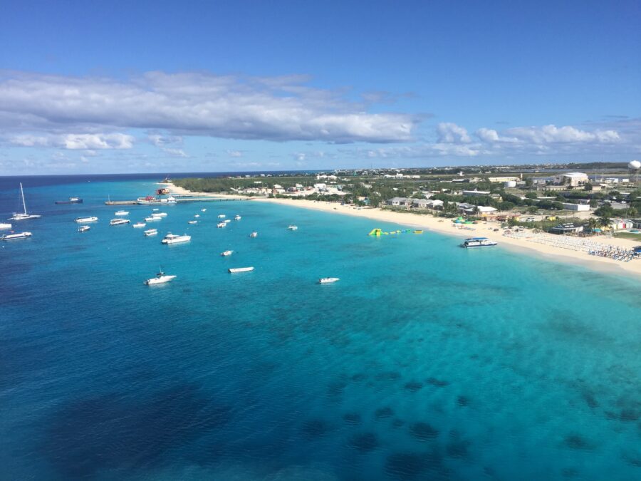 Scenic view of Governor’s Beach in Grand Turk, showcasing white sand, turquoise waters, and a clear blue sky