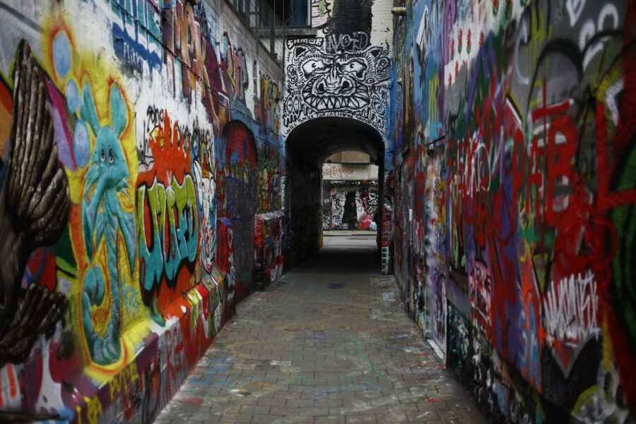 Colorful graffiti alley mural at Werregarenstraat, Ghent, Belgium.