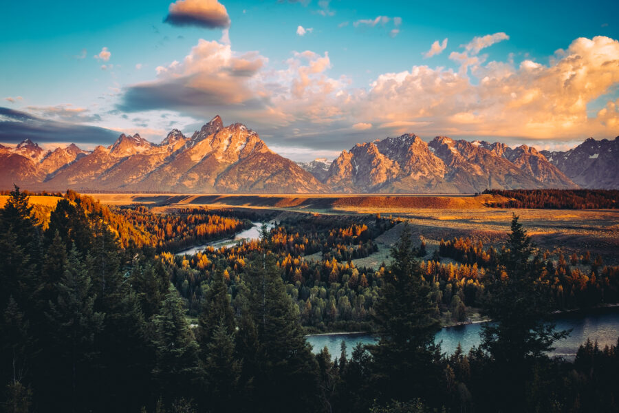 Grand Tetons peak illuminated by sunrise, overlooking the Snake River in Wyoming
