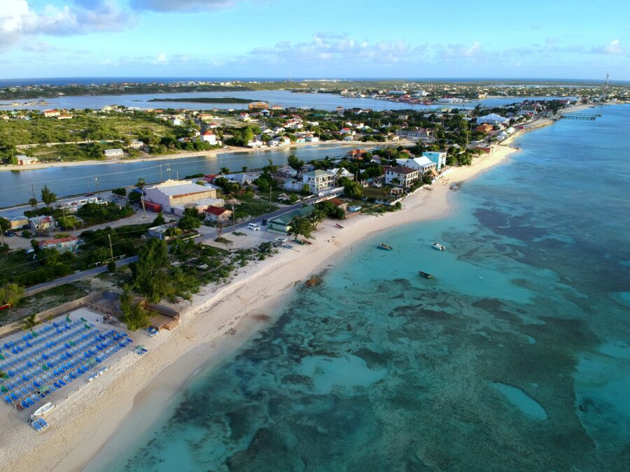 Aerial view of Grand Turk, showcasing pristine beaches and turquoise waters of the Turks and Caicos Islands