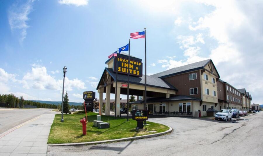 Exterior view of the Gray Wolf Inn & Suites building, showcasing its architecture and entrance.